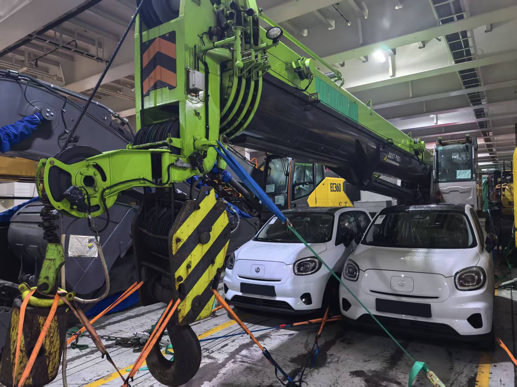 Heavy machinery and vehicles safely loaded together in an Africa-bound RORO vessel